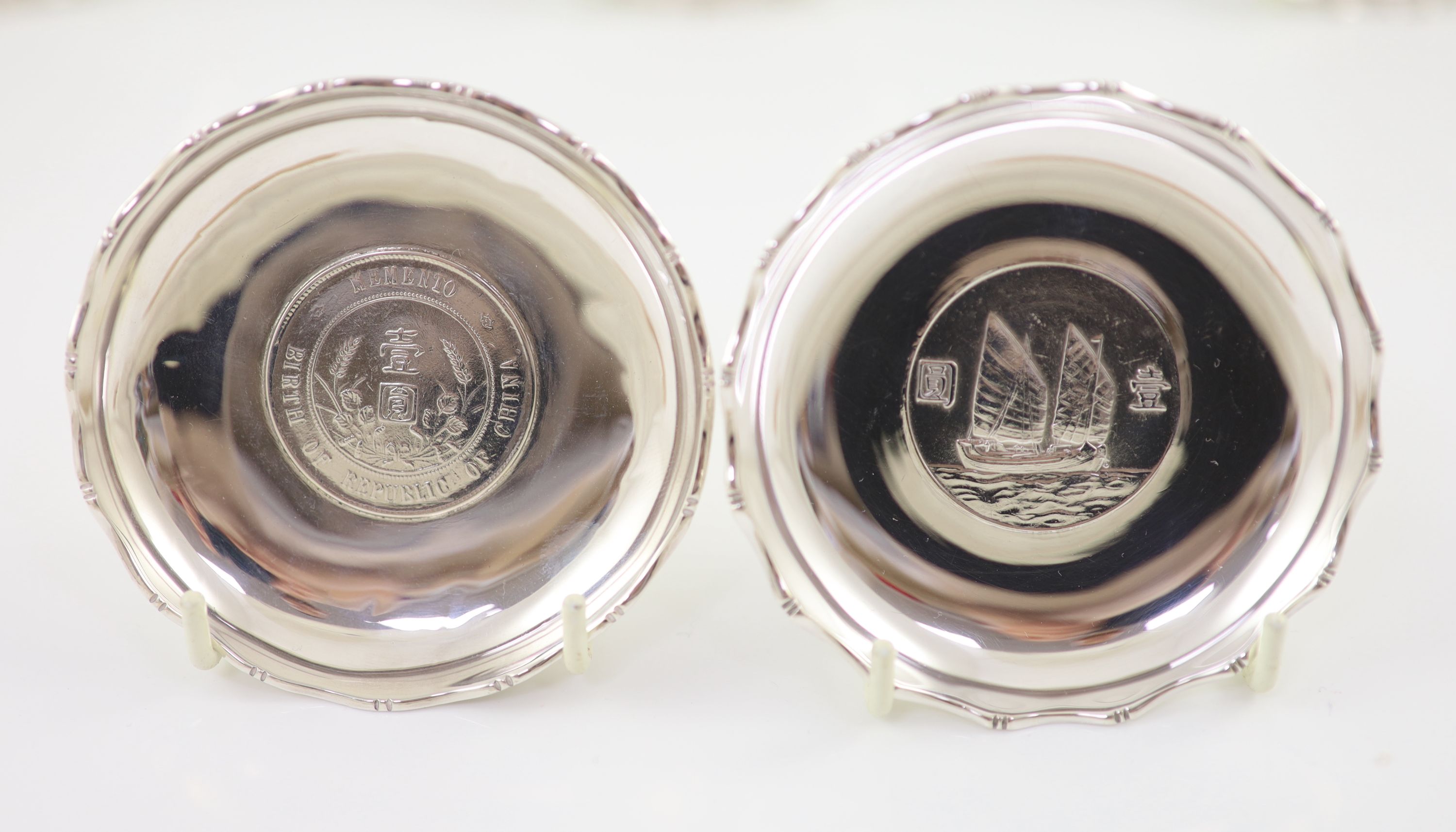 Ten early 20th century Chinese Export small Sterling silver coin inset dishes with shaped 'bamboo' edges, by Tach Hing, Hong Kong,